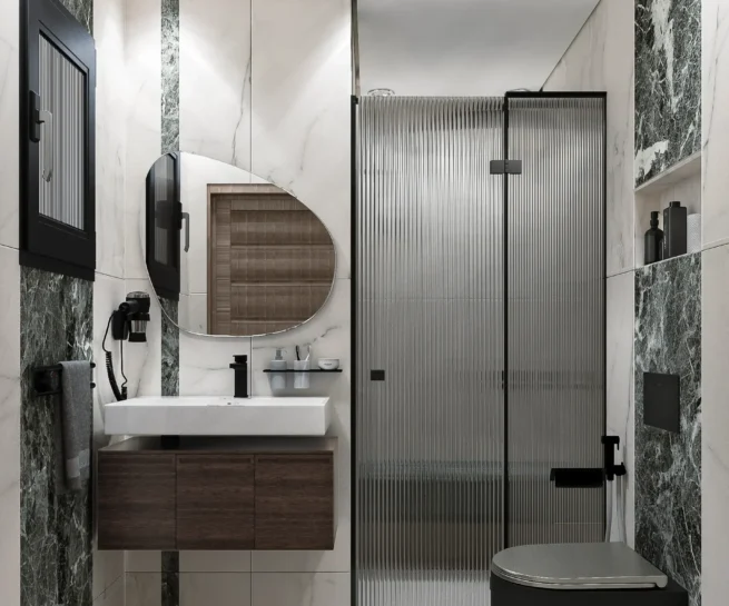 Modern luxury bathroom design by DICE ARCHI featuring green marble accents and black toilet.